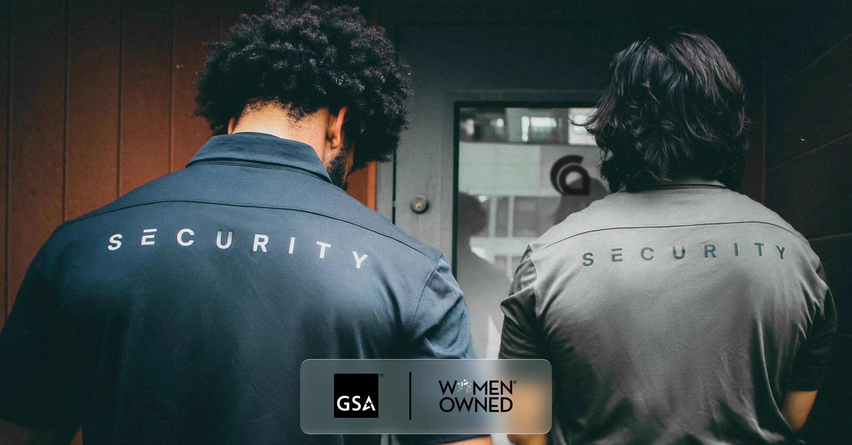 Two Ares Security officers in uniform polos at a building entrance, with GSA and Women Owned marks